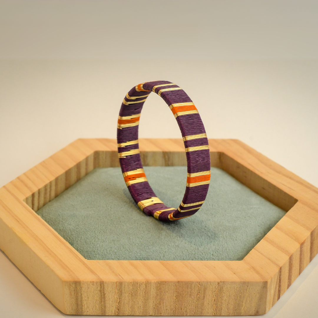 Bracelet violet orange tissé éthique Solnaré, fibres Werregue, fils dorés à l'or fin